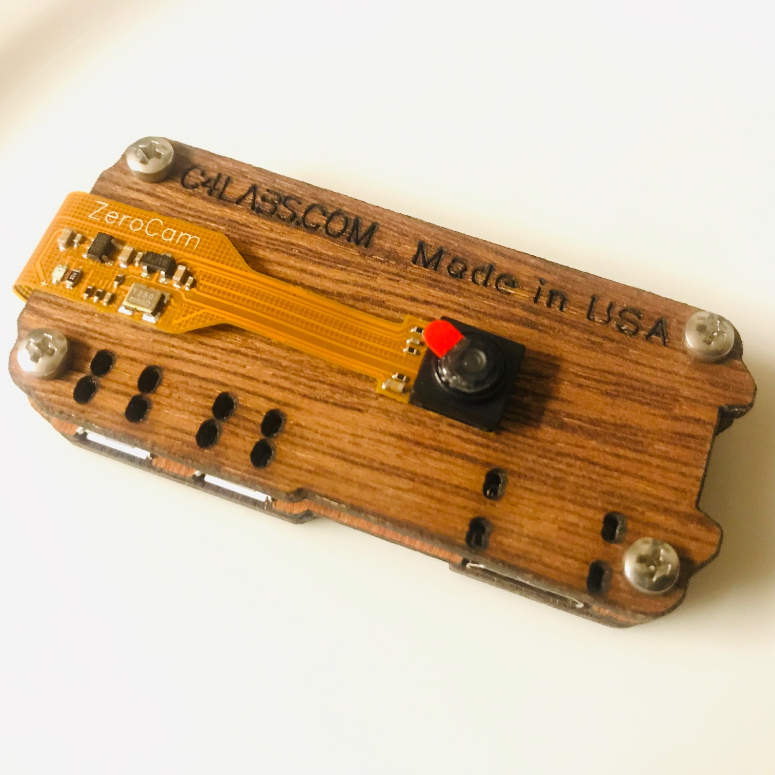 Raspberry Pi Zero in wooden case with camera attached